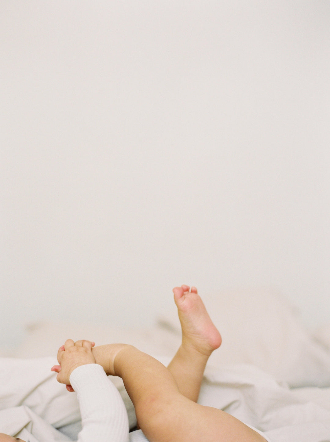 Baby feet on freshly washed laundry