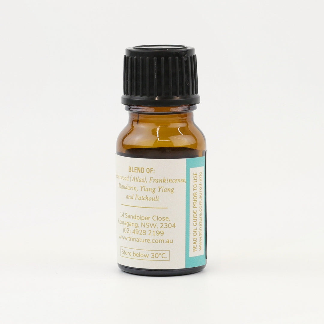 Tri Nature Unwind Essential Oil Blend bottle, blend of Mandarin, Frankincense, Ylang Ylang, Cedarwood and Patchouli