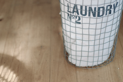 A vintage eco friendly cleaning wireframe laundry hamper with canvas lining