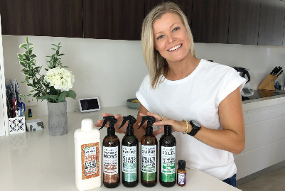 Leah Fernance and Tri Nature's Green Cleaning Starter Set in a clean white kitchen